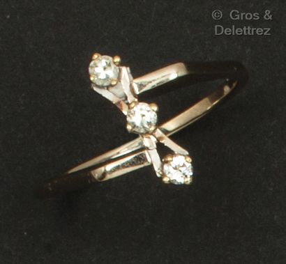 White gold ring set with three brilliant-cut...