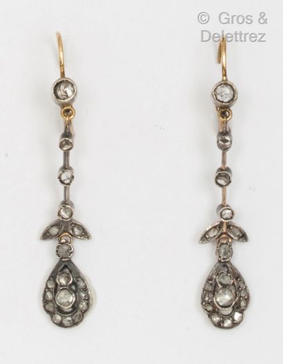 Pair of yellow gold and silver earrings with...