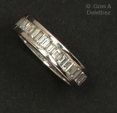 White gold ring set with a line of baguette...