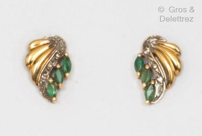 null A pair of yellow gold earrings, decorated with gadrooned scrolls underlined...