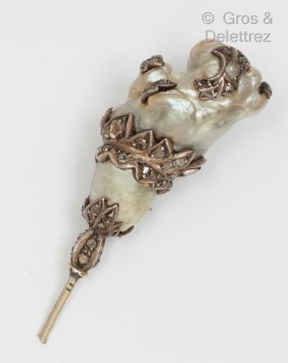 Silver hatpin, decorated with a large pearl...
