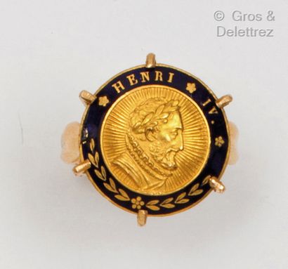 A yellow gold ring, partially enamelled in...