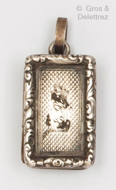 null Silver "Vinaigrette" pendant, decorated with a book chased with a figure in...