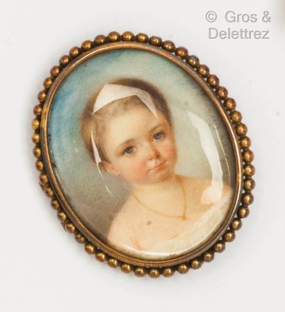 null A yellow gold oval brooch with a miniature of a child in a pearl frame. Size...