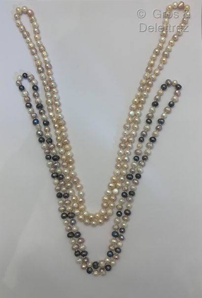 null Lot including a long necklace made of white cultured pearls and a long necklace...