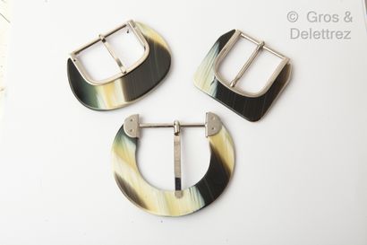 null Set of three horn and silver plated belt buckles.
