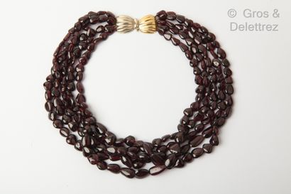 null Necklace composed of five rows of polished garnet beads, the vermeil clasp forming...