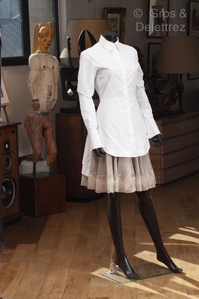 ALAÏA Outfit consisting of a white cotton shirt, small collar, single breasted, long...