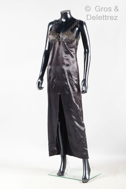 Paco RABANNE Long black satin dress, chest covered with varnished metal daisy motifs,...