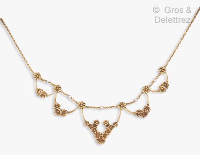null Yellow gold "Drapery" necklace, decorated with five motifs of florets alternated...