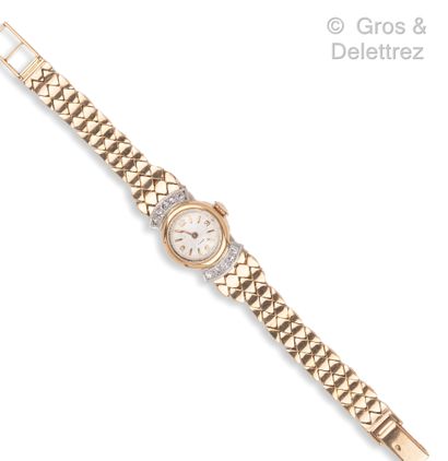 null Yellow gold ladies' wristwatch, round case (18 mm), the bezel composed of two...