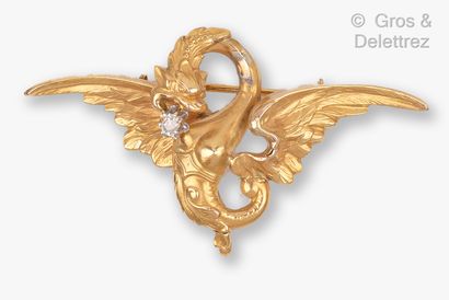  Carved yellow gold "Chimera" brooch holding an old cut diamond in its mouth. Size...