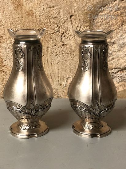 null A pair of silver plated soliflores vases with rocaille and acanthus decoration....