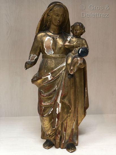 Sculpture en bois doré figurant la Vierge...
