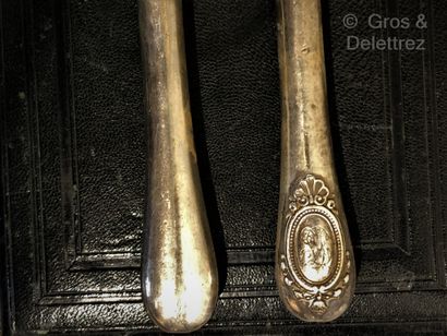 null Twelve knives with forged silver handles decorated with a pearl medallion with...