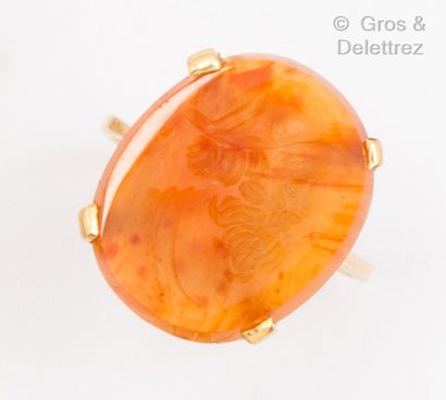 Yellow gold ring set with a carnelian intaglio...