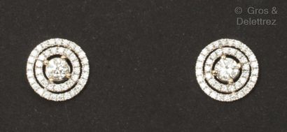 Pair of white gold earrings, each set with...