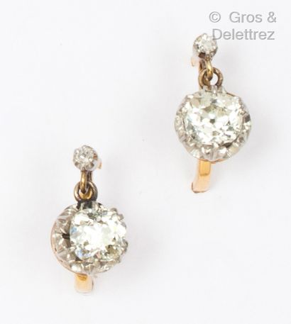 null A pair of yellow gold "Dormeuses" earrings, each set with an old cut cushion...