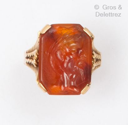 Yellow gold ring set with a carnelian intaglio...