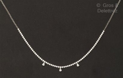A white gold necklace with sixty-five brilliant-cut...