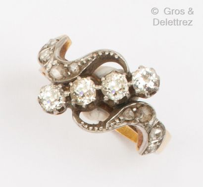 null Yellow gold and platinum "Volutes" ring, set with a line of old-cut diamonds...