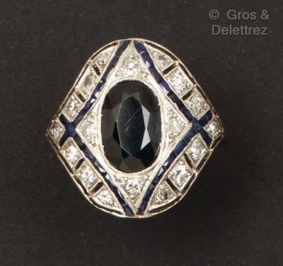 A platinum and white gold ring with a geometrical...