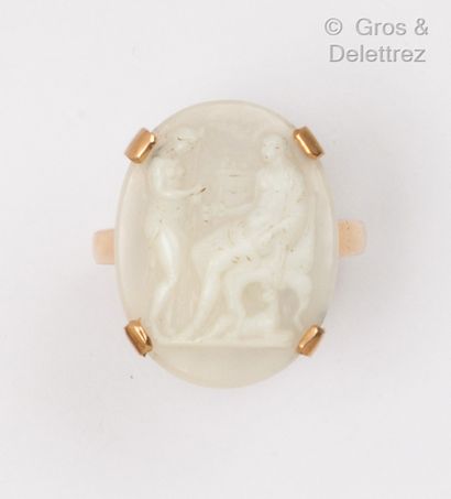 Yellow gold ring set with a cameo on white...