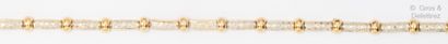 Bracelet articulé en or jaune, composé de...