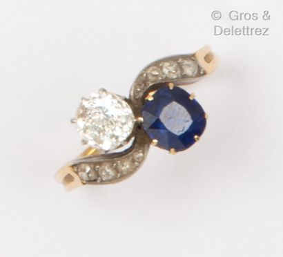 null 
Yellow gold and platinum "Toi et Moi" ring, featuring a faceted sapphire and...