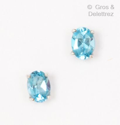 Pair of white gold earrings, each set with...