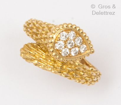 BOUCHERON "Bohemian Snake" - Guilloché yellow gold ring with scale decoration, highlighted...