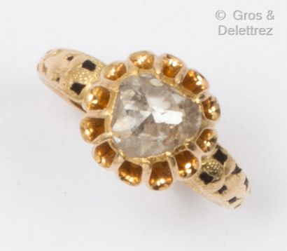 null Yellow gold ring with a rose-cut diamond crowned on a partially enameled setting....