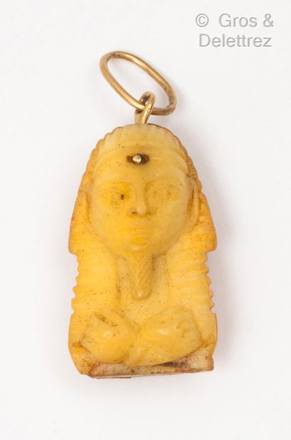 Bone pendant representing a Pharaoh, the...