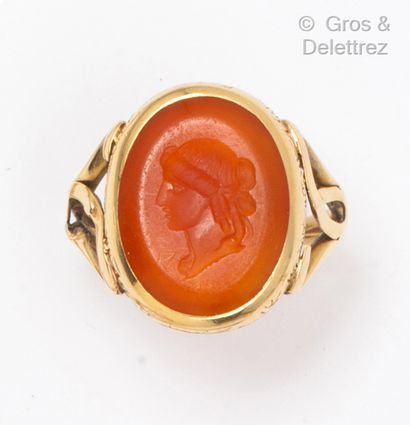 null Yellow gold ring, set with a carnelian intaglio representing the profile of...