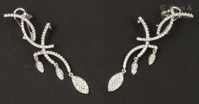 Pair of white gold earrings decorated with...