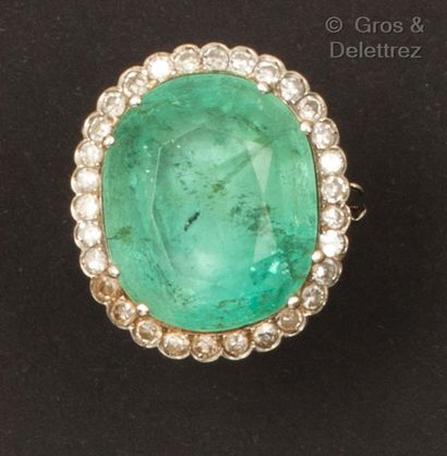 White gold ring, set with a large oval emerald...