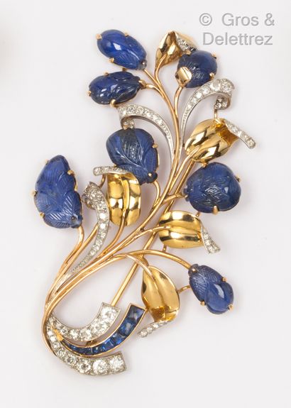 null Bouquet" brooch in yellow gold, the leaves stylized with engraved sapphires...
