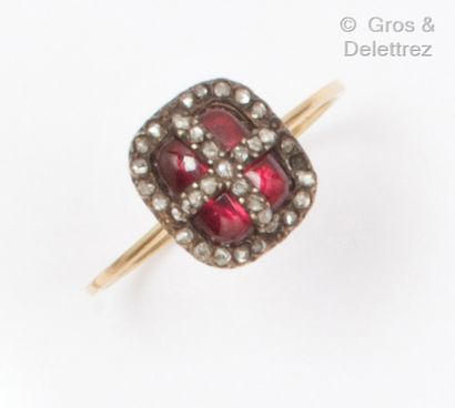 Yellow gold and silver ring, set with a garnet...