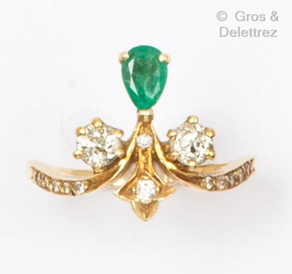null Yellow gold "Duchesse" ring, set with a pear-shaped emerald highlighted with...