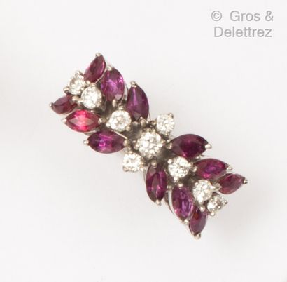 null 9K white gold ring set with navette-shaped rubies and brilliant-cut diamonds....