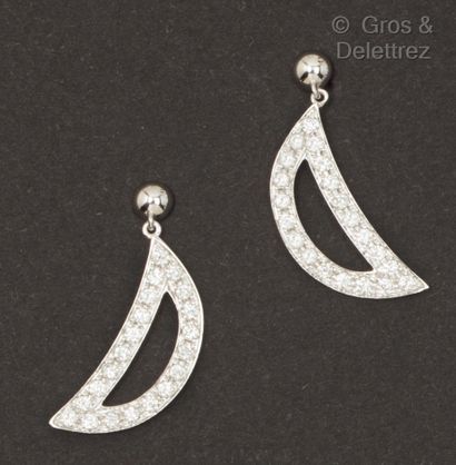 A pair of white gold earrings with a crescent-shaped...
