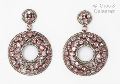 null Important pair of silver earrings, composed of two circular openwork designs...