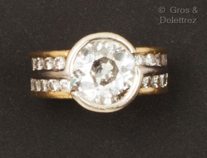 An important yellow and white gold ring,...
