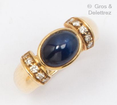 Yellow gold ring, set with an oval cabochon...