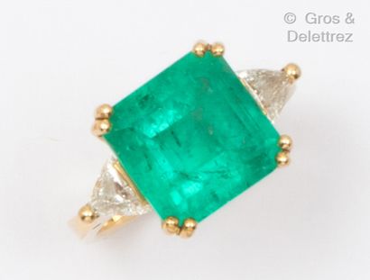 Yellow gold ring set with a square cut emerald...