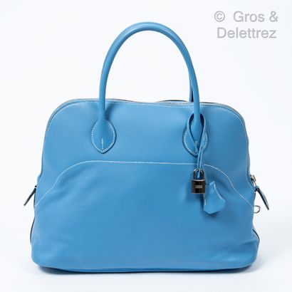 HERMÈS Paris made in France Year 2014

"Bolide" bag in Paradise blue Swift with white...