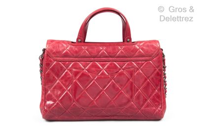 CHANEL Year 2011

35 cm bag in aged quilted calfskin, openwork flap releasing the...