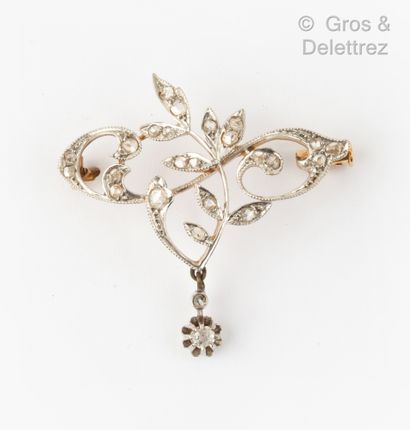 null Yellow and white gold "Volute" brooch decorated with foliage underlined by rose-cut...