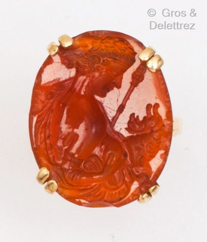 null A yellow gold ring set with a carnelian intaglio of Demeter. Finger size : 54....