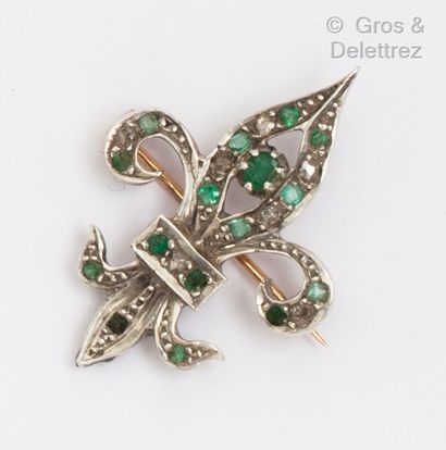 null A yellow gold and silver fleur-de-lis brooch set with emeralds and rose-cut...